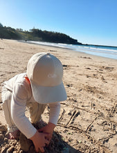 Load image into Gallery viewer, kid playing with sand on a beach
